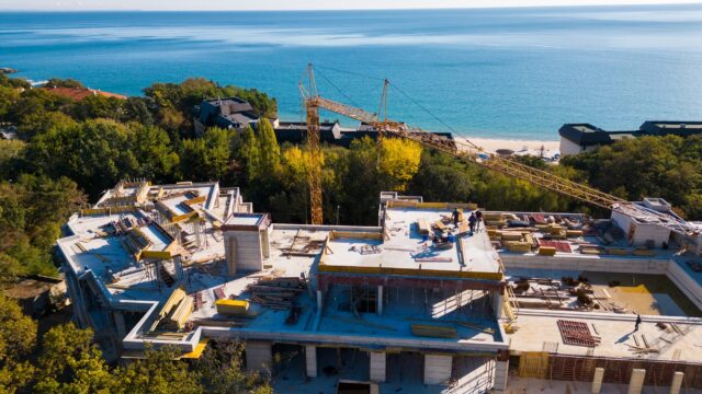 Aerial view of the construction of a massive beachfront hotel